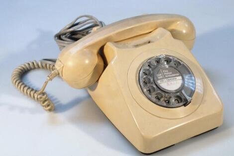 A cream plastic telephone