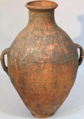 A 20thC baked earthenware Grecian style flagon