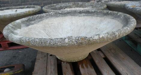 A large concrete Mexican hat style garden planter