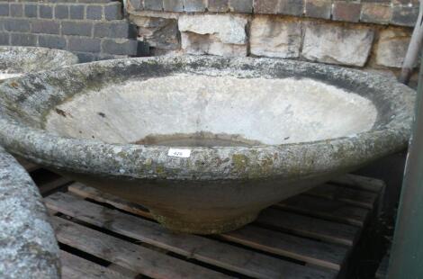 A large concrete Mexican hat style garden planter