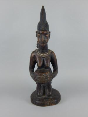 Tribal Art. An African carved wooden figure - 2