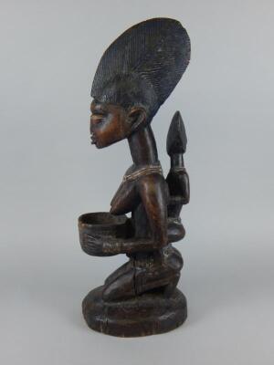 Tribal Art. An African carved wooden figure - 3