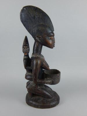 Tribal Art. An African carved wooden figure - 5