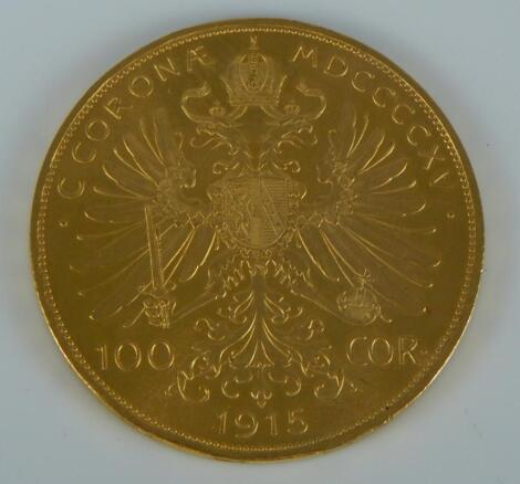 A 1915 gold one hundred Corona coin.