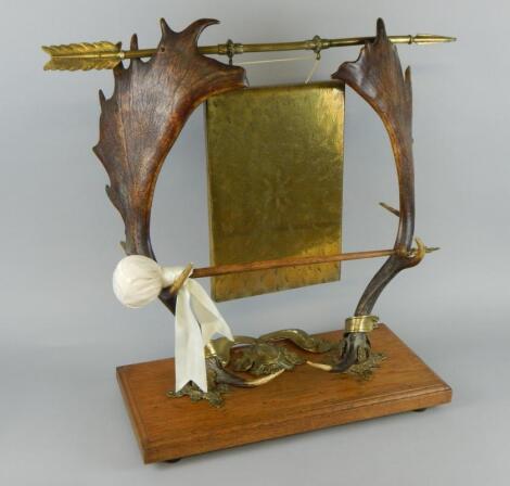 A Victorian brass dinner gong