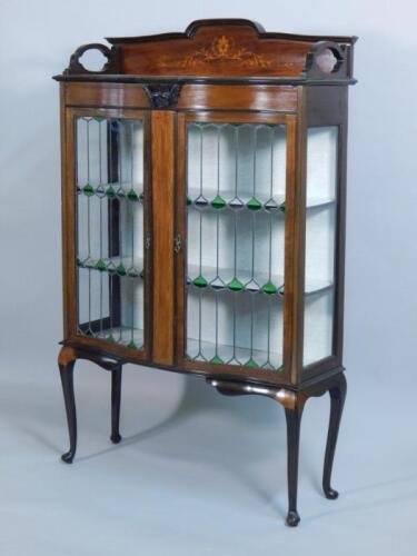 An Edwardian mahogany and marquetry display cabinet