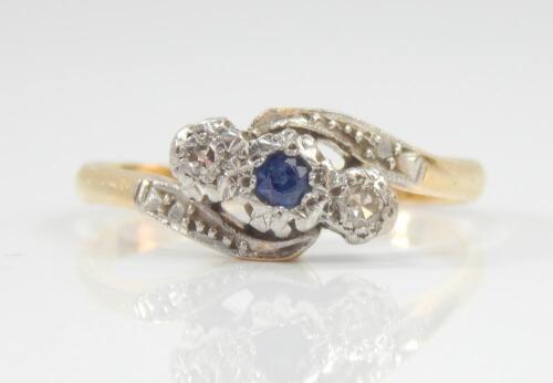 A diamond and sapphire crossover ring