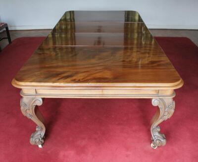 A Victorian figured mahogany extending dining table