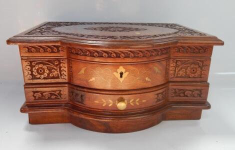 An inlaid and relief carved mahogany jewellery box