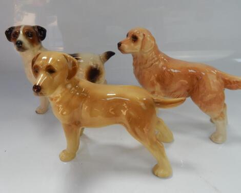 Three Coopercraft ceramic dogs.