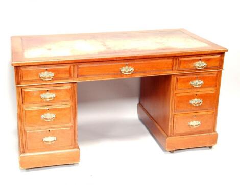 A late Victorian walnut twin pedestal desk