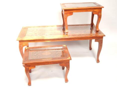 A trio of oriental inlaid mahogany glass topped tables