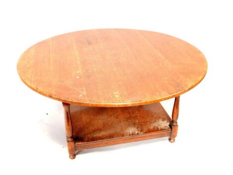 A circular oak coffee table