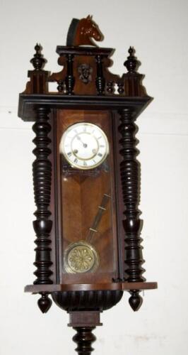 A late 19thC Black Forest walnut wall clock