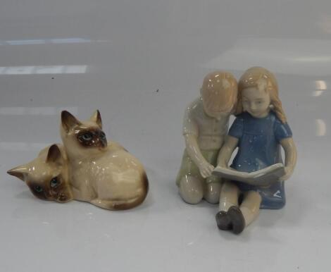 A Royal Doulton figure of Siamese cats