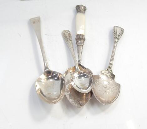 Two silver slicers and two silver spoons