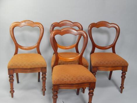 A set of four Victorian mahogany balloon back dining chairs