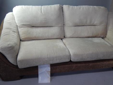 A leatherette finish three seater sofa