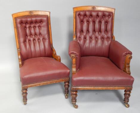 A pair of Victorian ladies and gents open armchairs