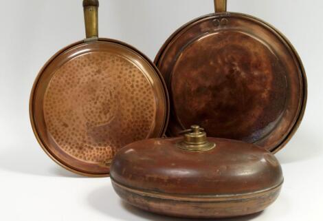 Two copper warming pans