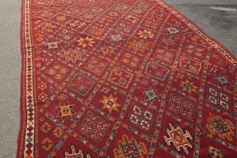 A Middle Eastern large knotted carpet