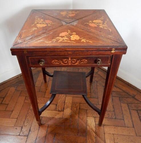 A late Victorian inlaid rosewood envelope card table