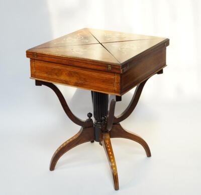 A late Victorian rosewood and marquetry envelope folding card table