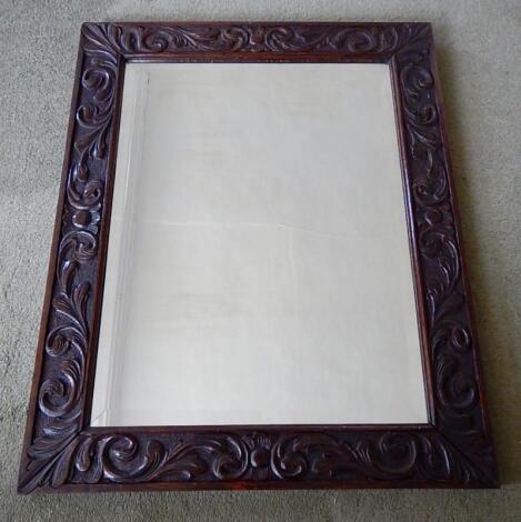 A bevelled rectangular wall mirror