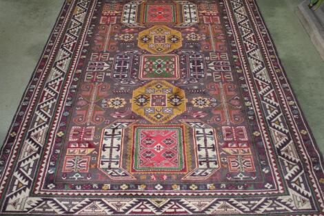 A Middle Eastern bordered rug