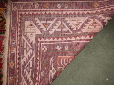 A Middle Eastern bordered rug - 2