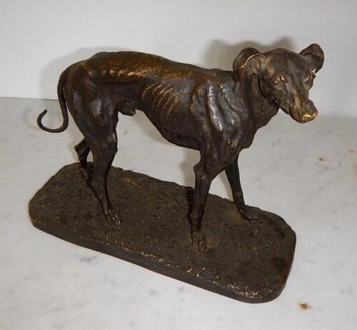 After Pierre Jules Mene (1810-1879). A bronze sculpture of a standing Greyhound on a rustic base