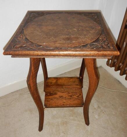 An Edwardian oak square occasional table