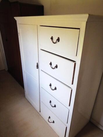 A low white painted wardrobe chest