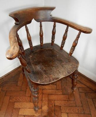 A 19thC elm and beech smokers bow chair