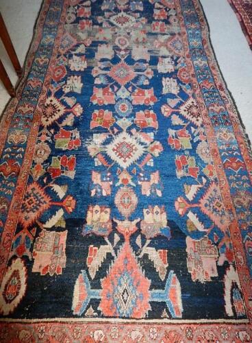 A 19thC Middle Eastern bordered rug