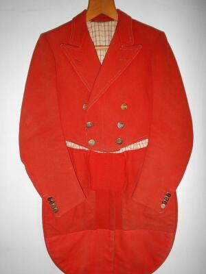 A vintage scarlet cutaway hunting coat