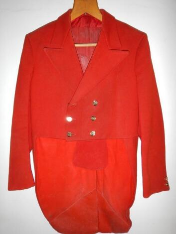 A vintage scarlet cutaway hunting coat