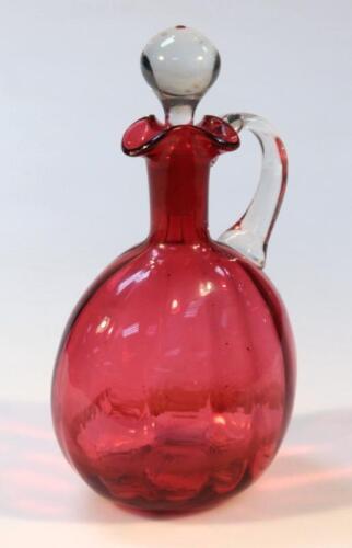A Victorian cranberry glass ewer