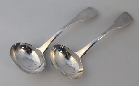 A pair of George III silver fiddle pattern sauce ladles