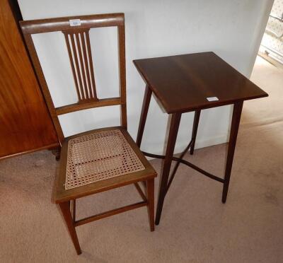 An Edwardian cane seated inlaid mahogany single chair