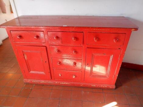 A Victorian red painted pine dresser base