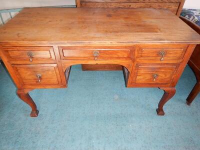 A mahogany kneehole dressing table