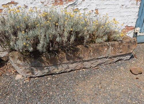 A large stone trough