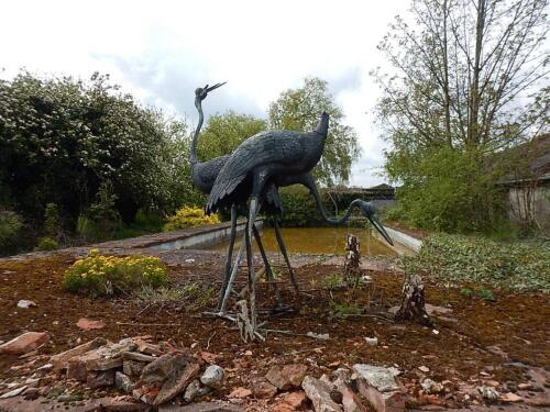 A bronze sculpture of standing cranes. (AF)