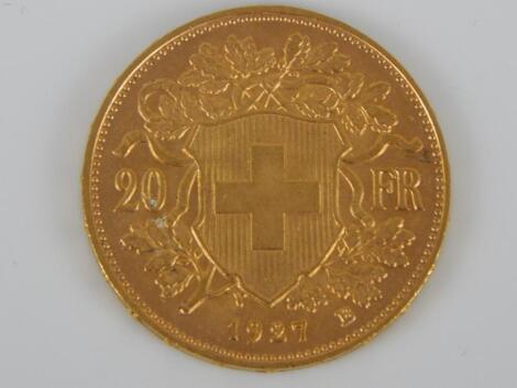 A gold 20 Swiss franc coin