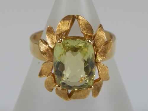 A peridot set dress ring