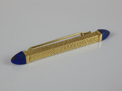 A bar brooch