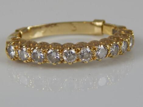 A diamond half hoop eternity ring