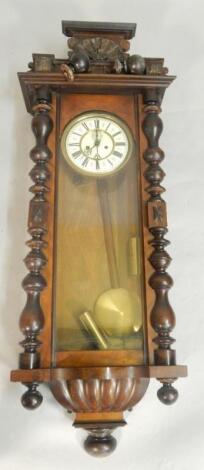 A late 19thC Vienna type walnut wall clock