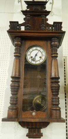 A late 19thC Vienna type walnut wall clock